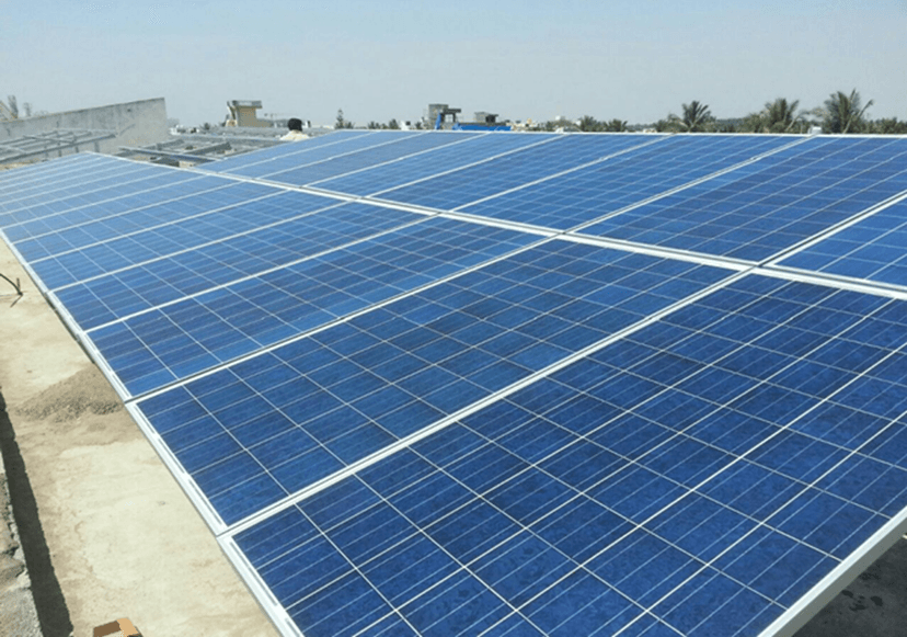 Ground-mounted solar panel array in field